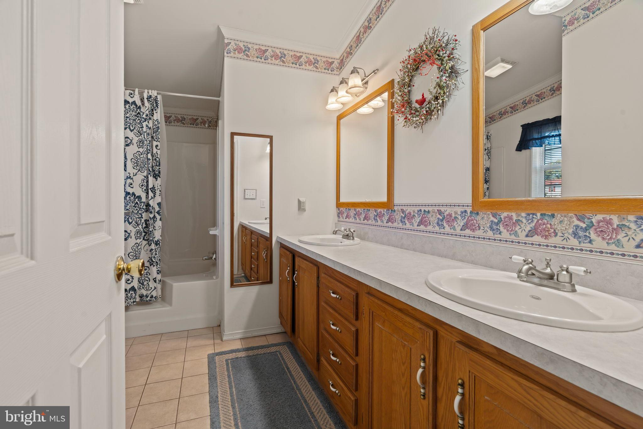 561 Spring Meadow Circle New Hope, PA 18938 - Photo 17 of 23 a spacious bathroom with a sink double vanity and a mirror