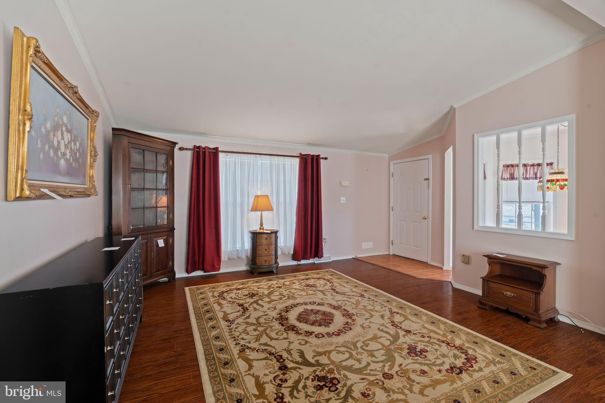 561 Spring Meadow Circle New Hope, PA 18938 - Photo 6 of 23 a bedroom with a bed and a dresser with wooden floor