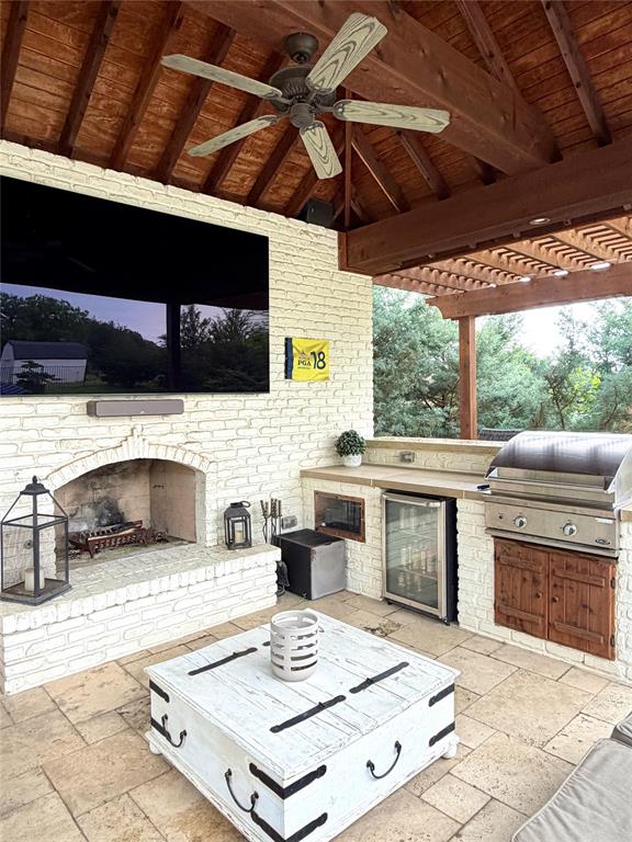 1304 Tinker Road Colleyville, TX 76034 - Photo 27 of 28 a kitchen with a stove a sink and a microwave