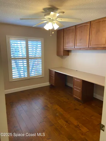 a view of a kitchen with microwave and cabinets