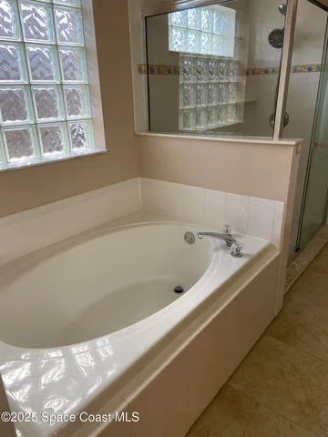 a bath tub sitting next to a window