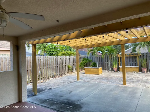 a view of back yard with porch