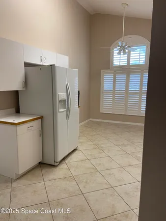 a kitchen with appliances cabinets and a window