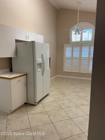 a kitchen with appliances cabinets and a window