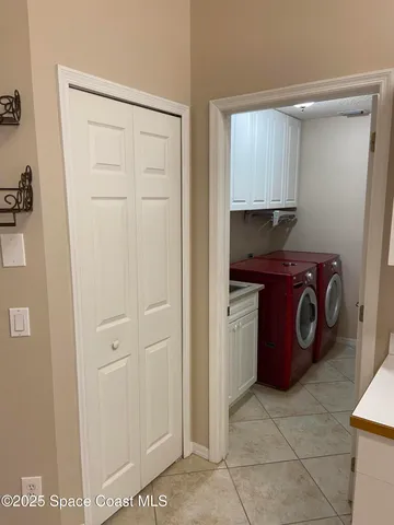 a view of a storage & utility room with a sink