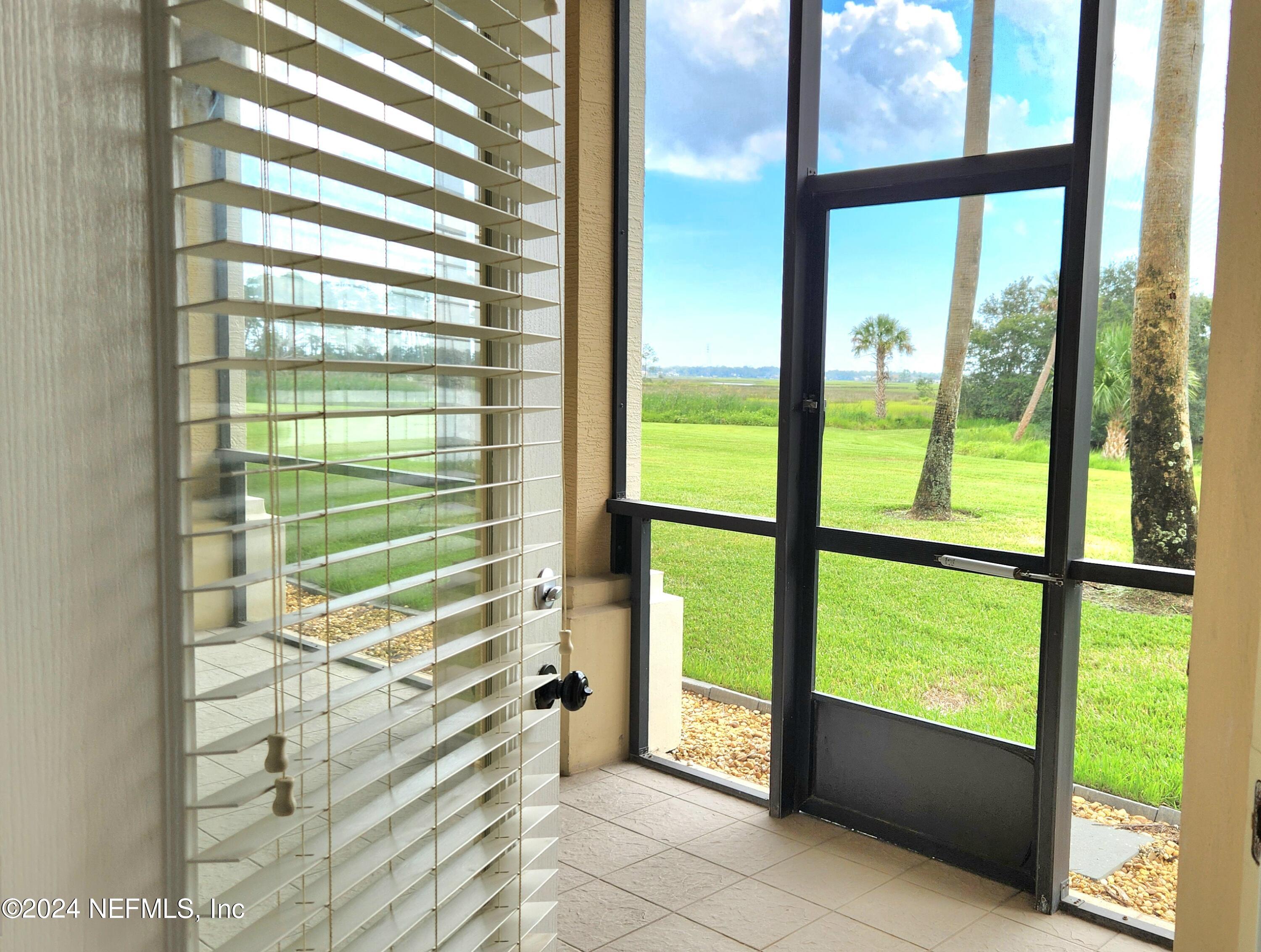 13846 Atlantic Boulevard, Unit 1004 Jacksonville, FL 32225 - Photo 27 of 55 Primary suite exit to Lanai