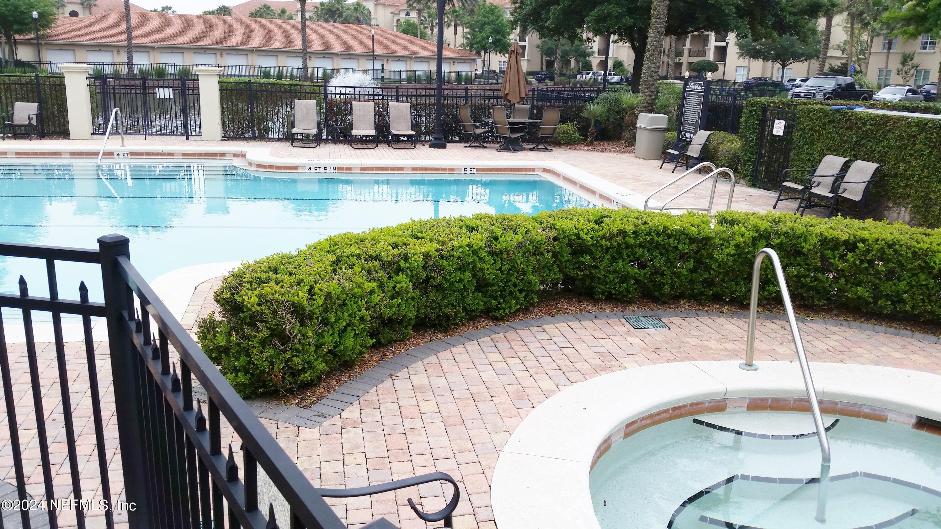 13846 Atlantic Boulevard, Unit 1004 Jacksonville, FL 32225 - Photo 47 of 55 Community Pool and Hot Tub