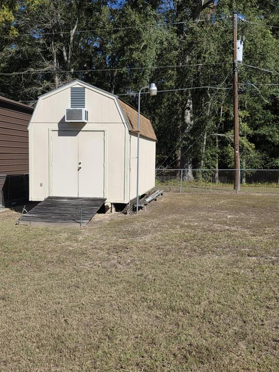 123 Frank Drive Logansport, LA 71049 - Photo 12 of 32 a view of a white house with a yard