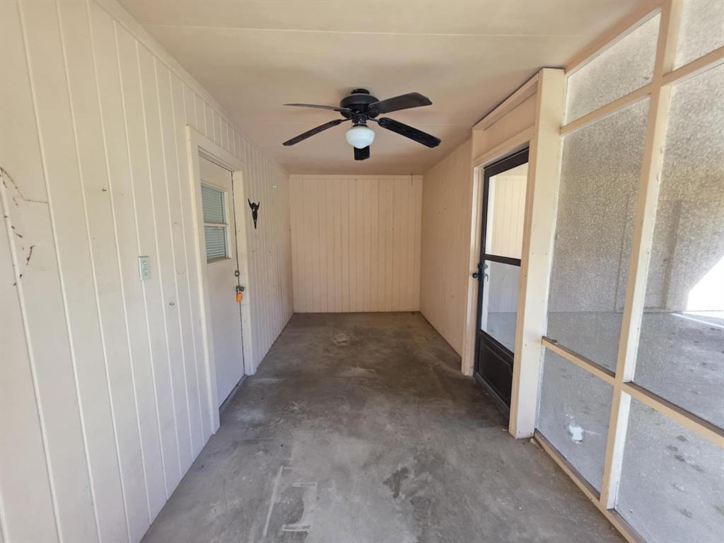 123 Frank Drive Logansport, LA 71049 - Photo 13 of 32 a view of a hallway with a chandelier