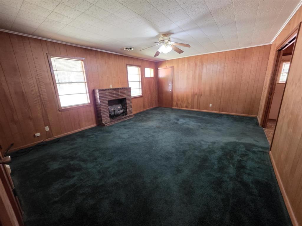123 Frank Drive Logansport, LA 71049 - Photo 21 of 32 an empty room with windows and fireplace