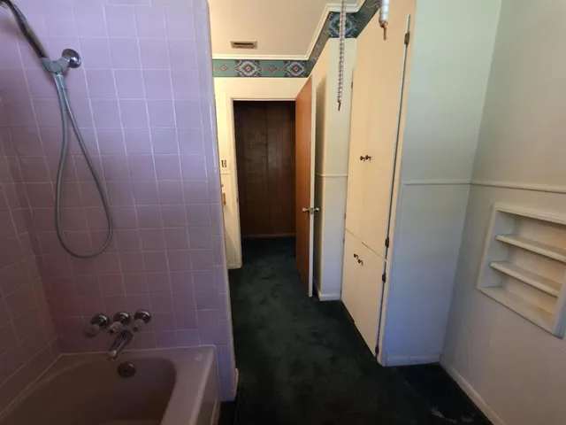 a bathroom with a sink and shower