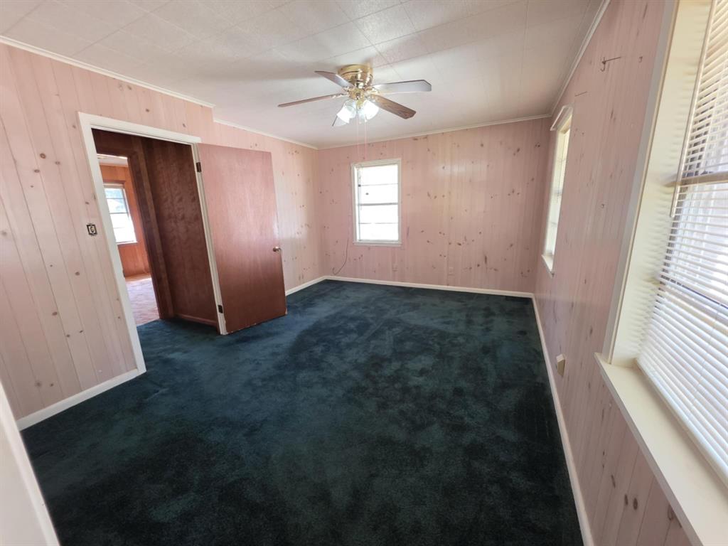 123 Frank Drive Logansport, LA 71049 - Photo 27 of 32 an empty room with windows and fan