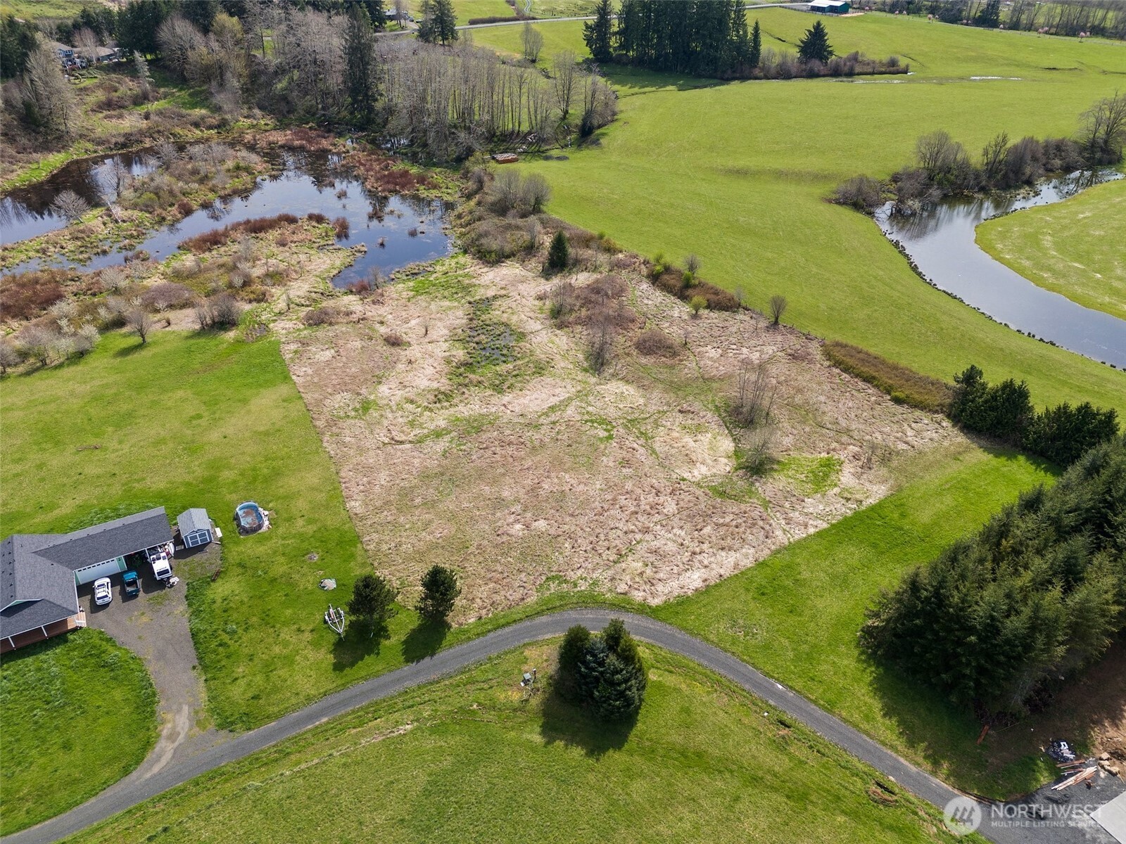 0 X Lilly Wheaton Road Raymond, WA 98577 - Photo 6 of 14 an aerial view of a house with a yard