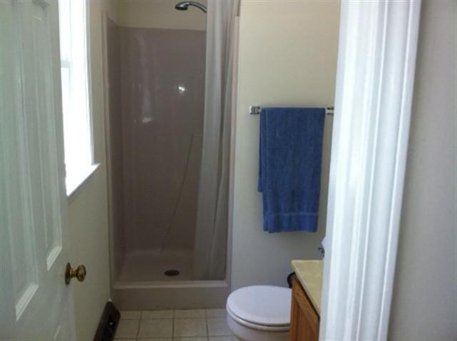 25 Valley Brook Road Centerville, MA 02632 - Photo 7 of 12 a bathroom with a toilet a sink and shower