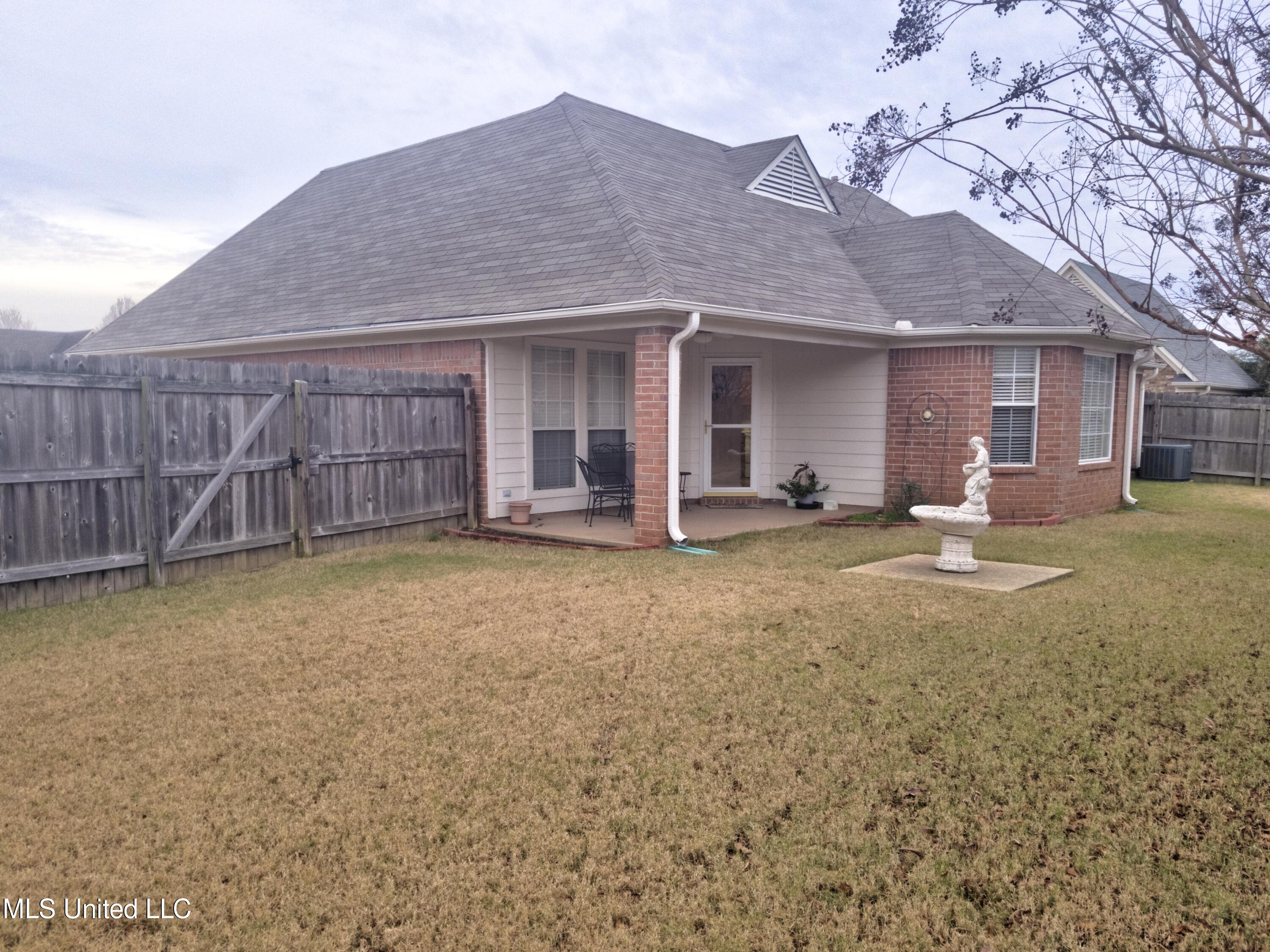 7703 Alexanders Ridge Cove Olive Branch, MS 38654 - Photo 8 of 10 7703 Alexaders Ridge Cv Rear Ext 1