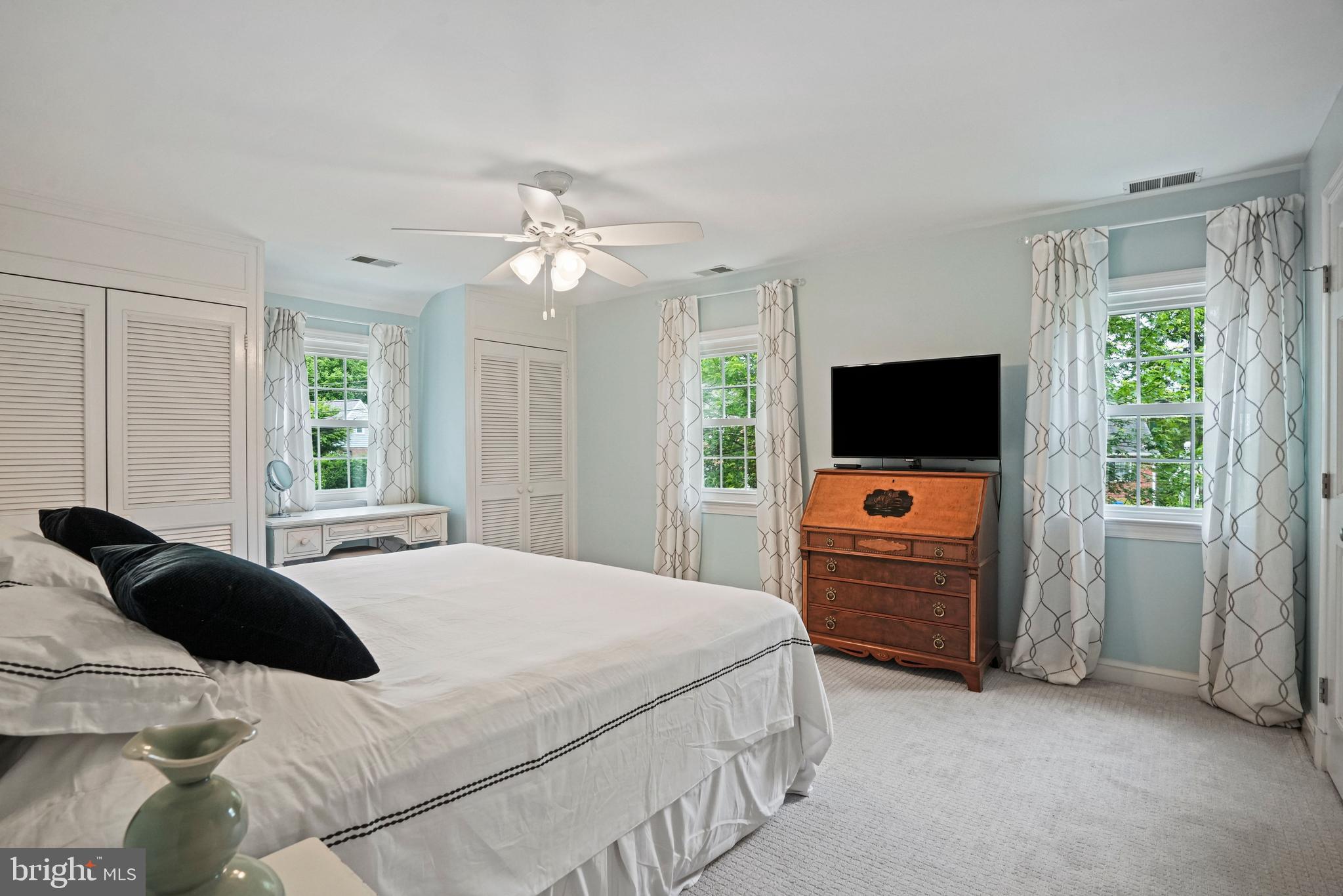 1907 Brisbane Street Silver Spring, MD 20902 - Photo 18 of 39 a bedroom with a bed flat screen tv and a window