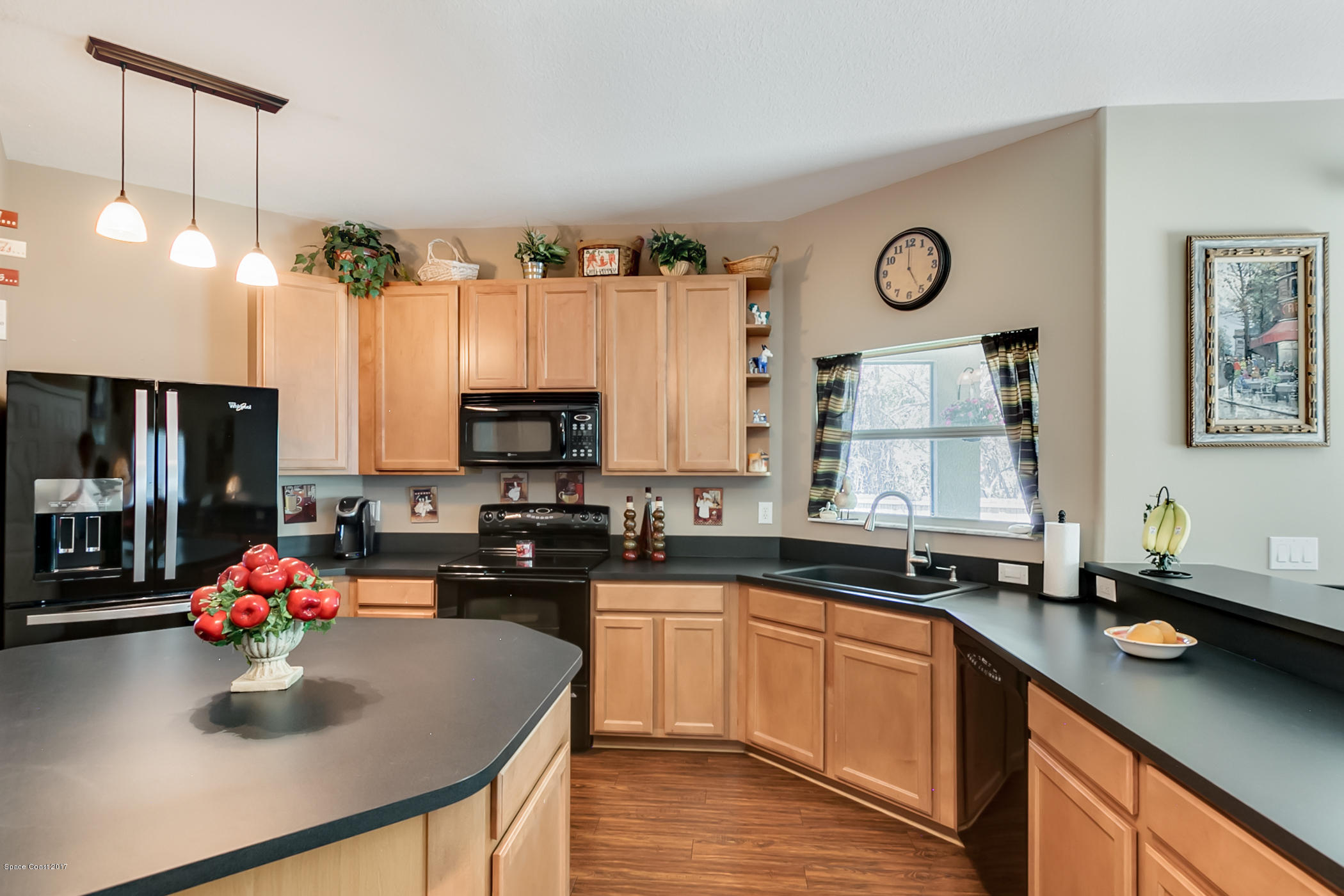 3330 Carter Road Mims, FL 32754 - Photo 14 of 37 a kitchen with a sink cabinets and window
