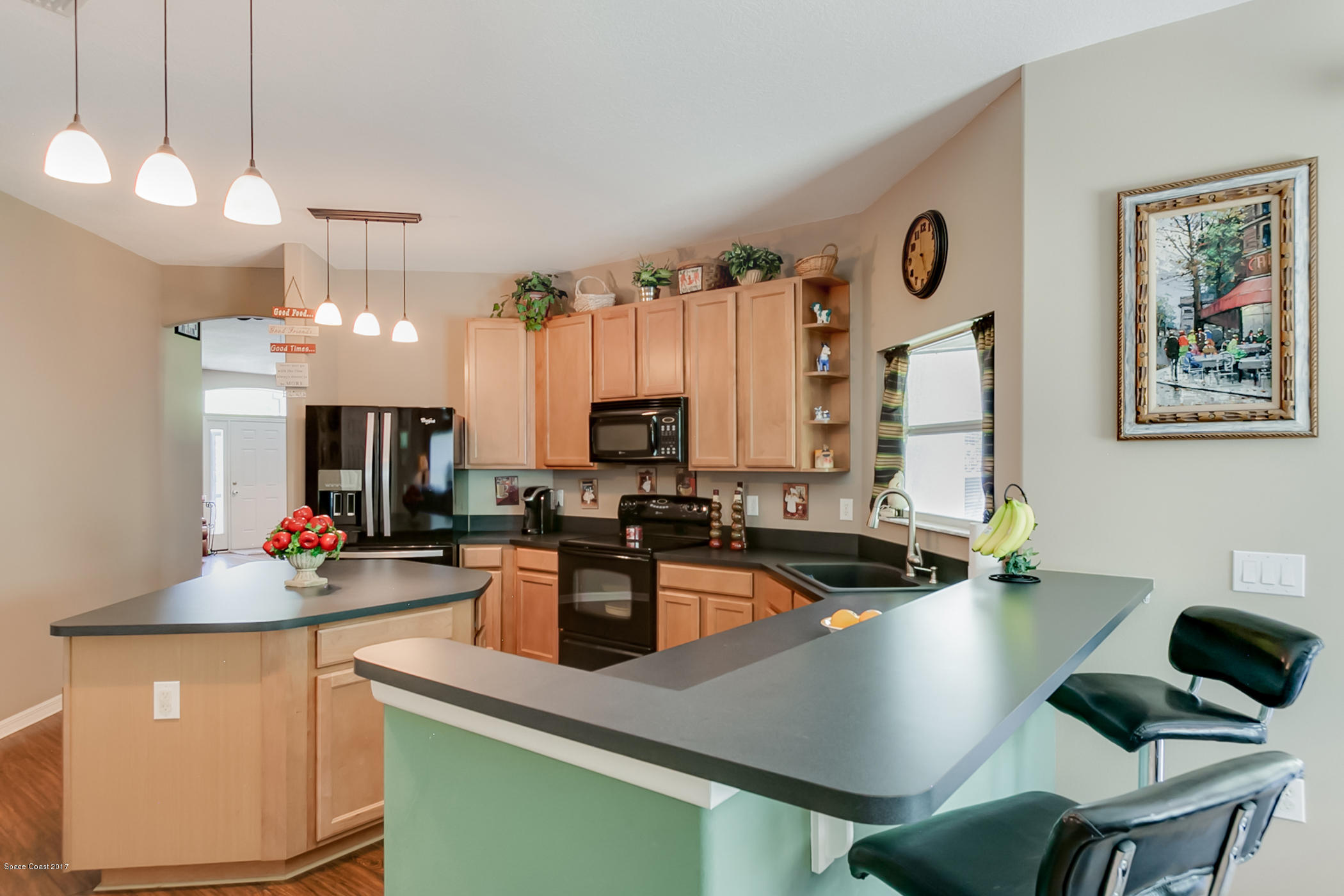 3330 Carter Road Mims, FL 32754 - Photo 15 of 37 a kitchen with a sink cabinets and window