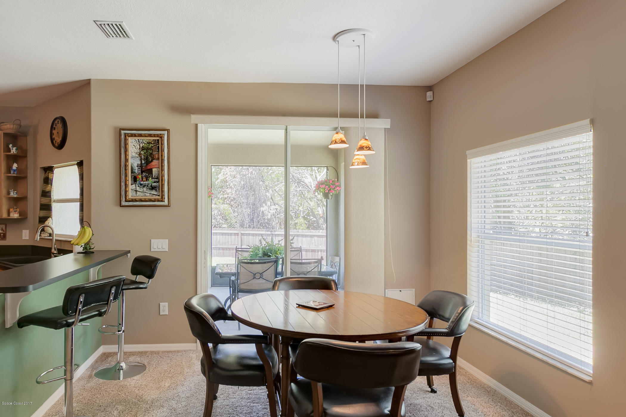 3330 Carter Road Mims, FL 32754 - Photo 16 of 37 a view of a dining room with furniture window and outside view