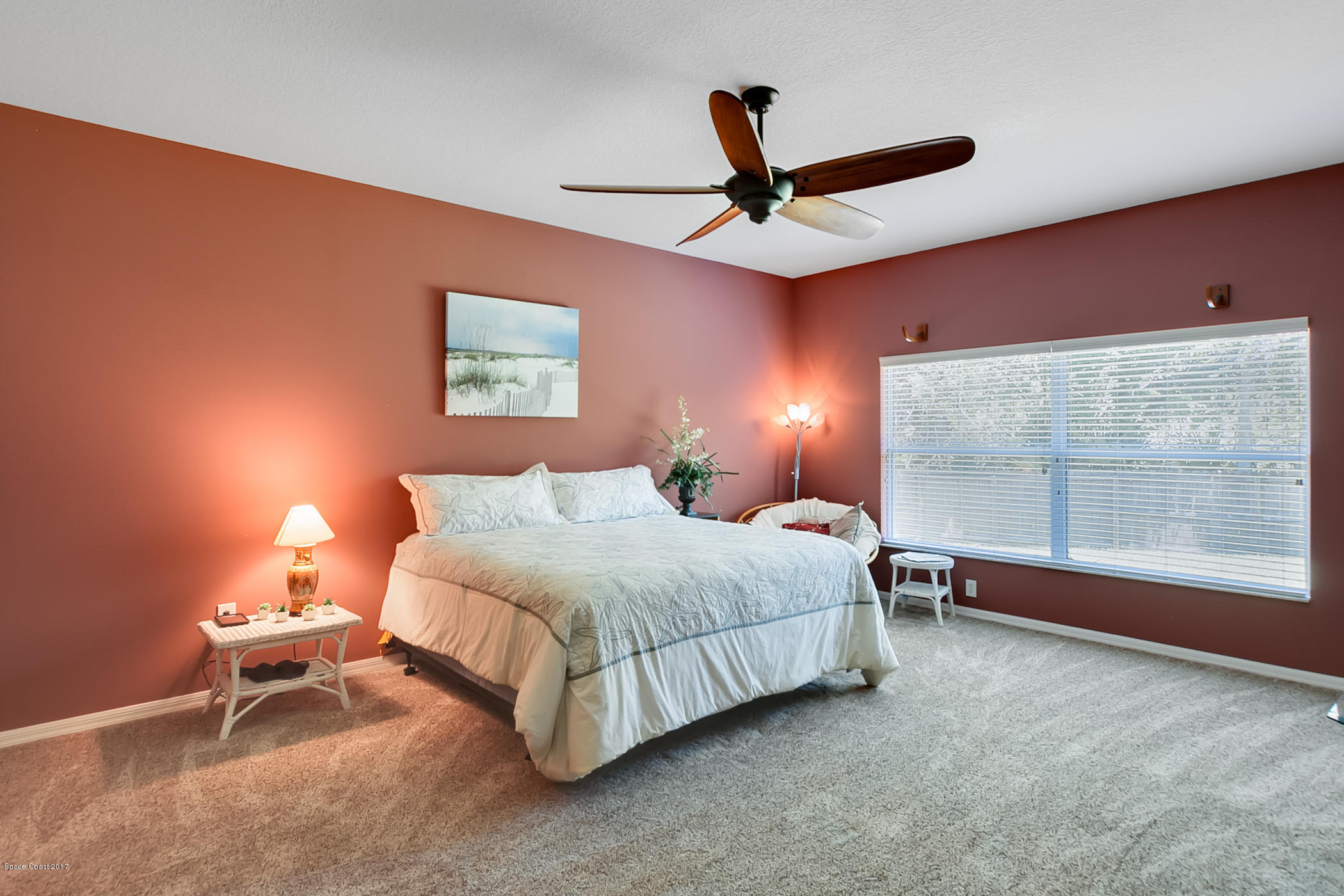 3330 Carter Road Mims, FL 32754 - Photo 19 of 37 a spacious bedroom with a bed and a large window