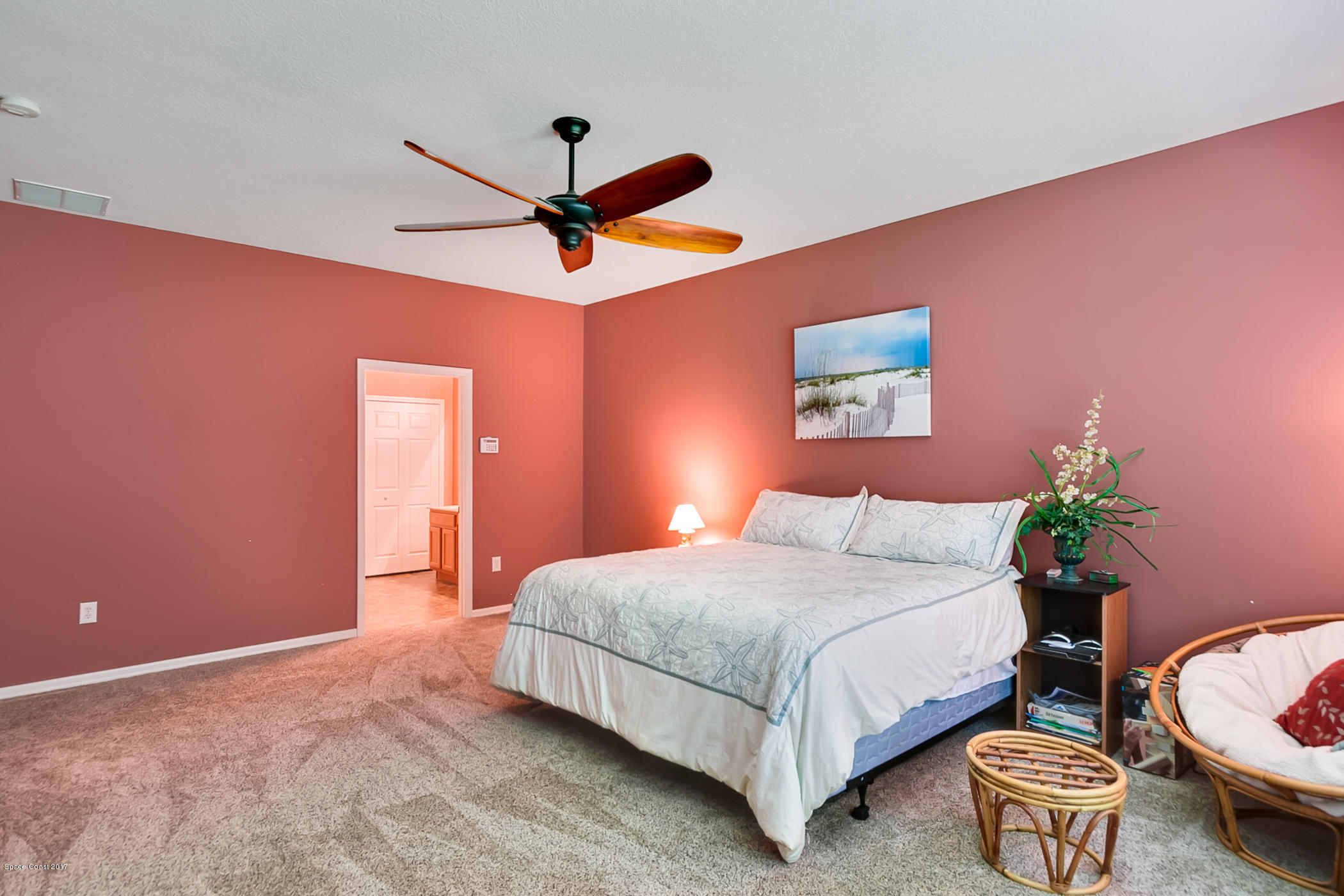 3330 Carter Road Mims, FL 32754 - Photo 20 of 37 a bedroom with a bed chandelier and a window