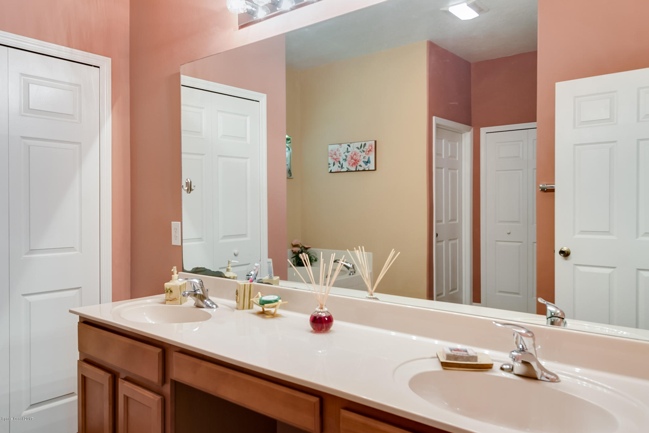 3330 Carter Road Mims, FL 32754 - Photo 22 of 37 a bathroom with a sink and a mirror