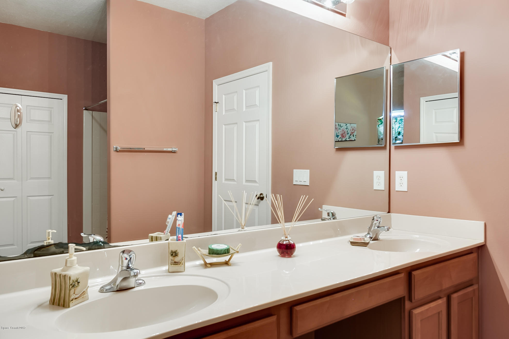 3330 Carter Road Mims, FL 32754 - Photo 24 of 37 a bathroom with a sink and a mirror