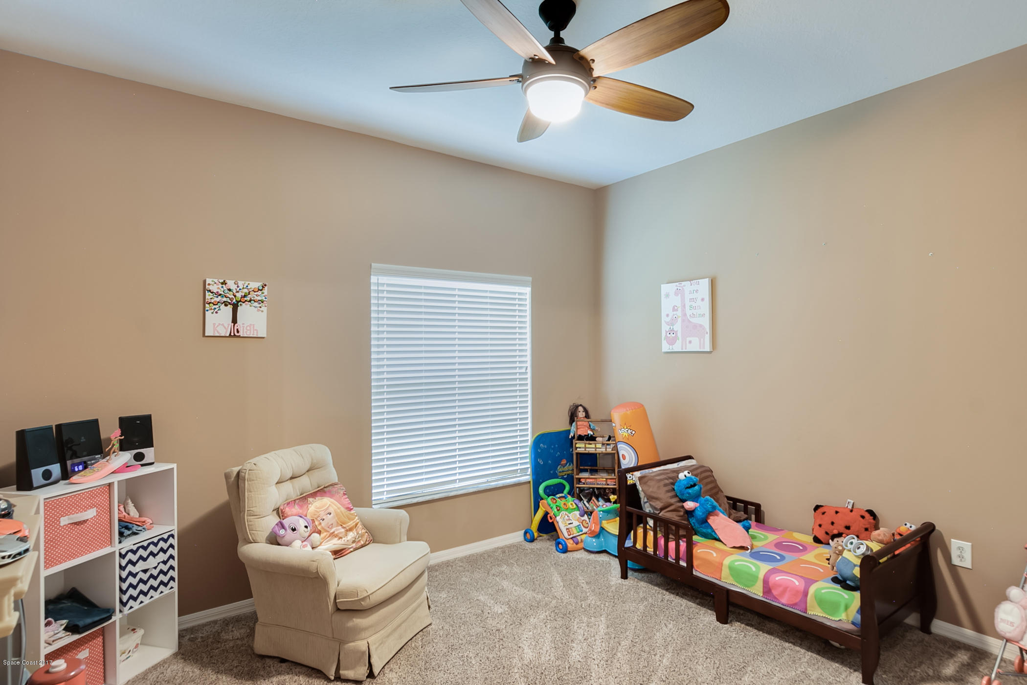 3330 Carter Road Mims, FL 32754 - Photo 27 of 37 a bedroom with furniture and a window