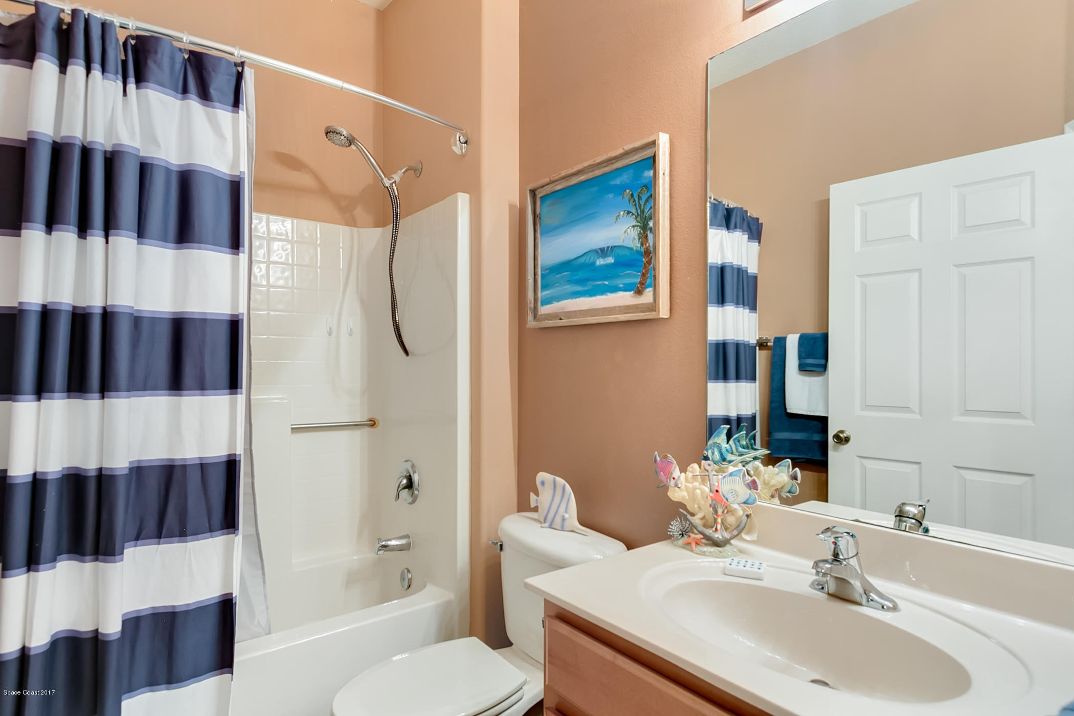 3330 Carter Road Mims, FL 32754 - Photo 28 of 37 a bathroom with a sink a toilet and shower