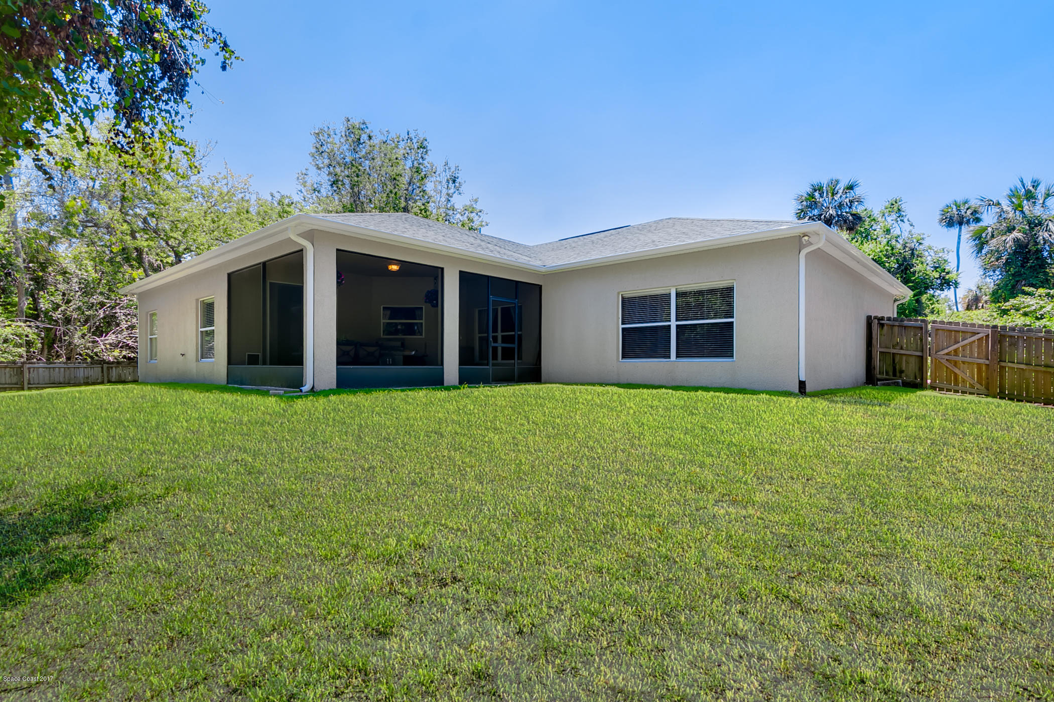 3330 Carter Road Mims, FL 32754 - Photo 35 of 37 a front view of house with yard and green space