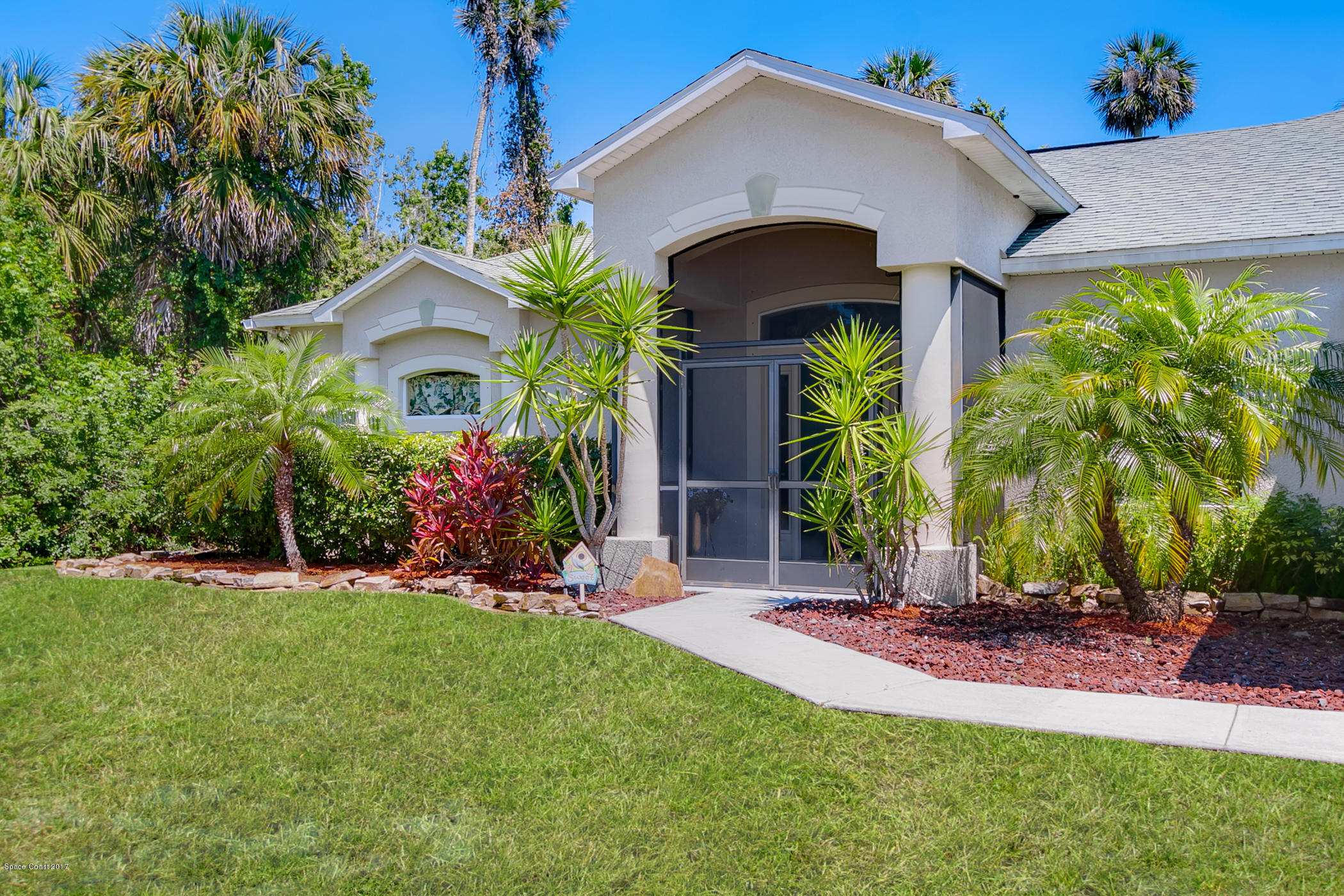 3330 Carter Road Mims, FL 32754 - Photo 5 of 37 a front view of house with yard and green space