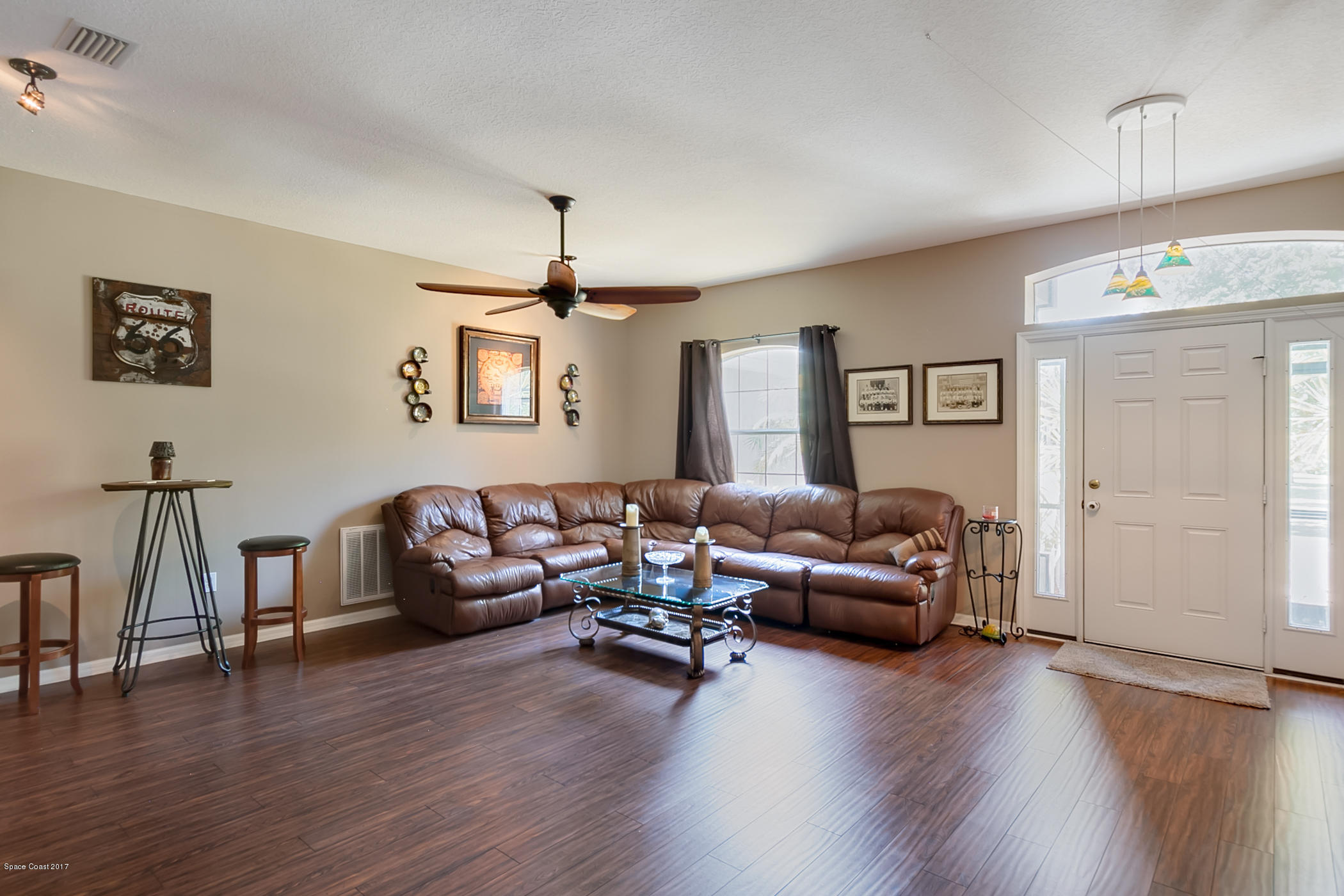 3330 Carter Road Mims, FL 32754 - Photo 7 of 37 a living room with furniture and a wooden floor