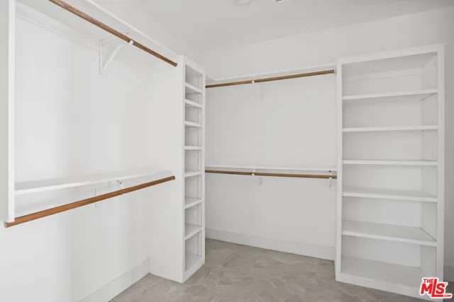 a view of an empty walk in closet