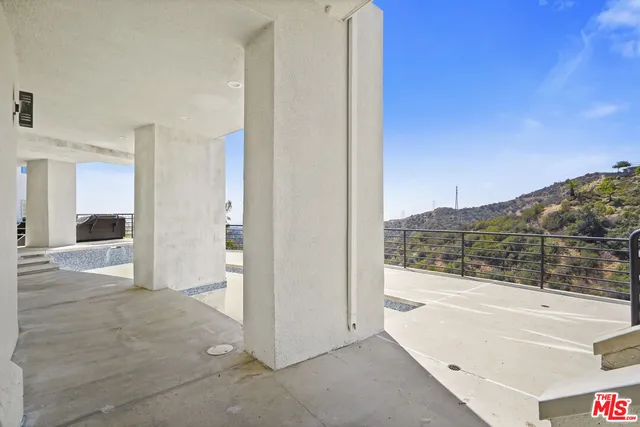 a view of a living room with a large window