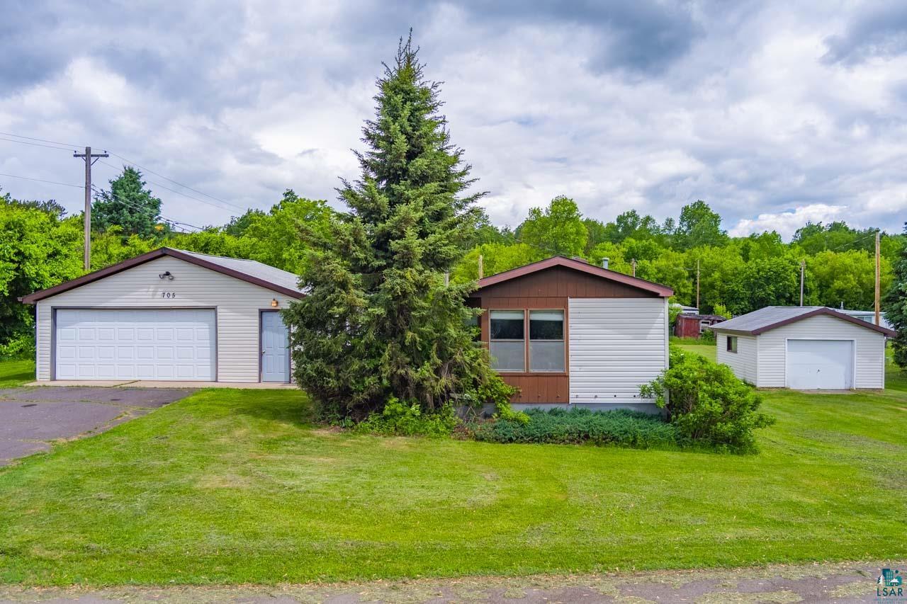 705 4th Street North Biwabik, MN 55708 - Photo 24 of 29 Property exterior featuring a primary residence, a detached two-car garage, and an additional detached single-car garage