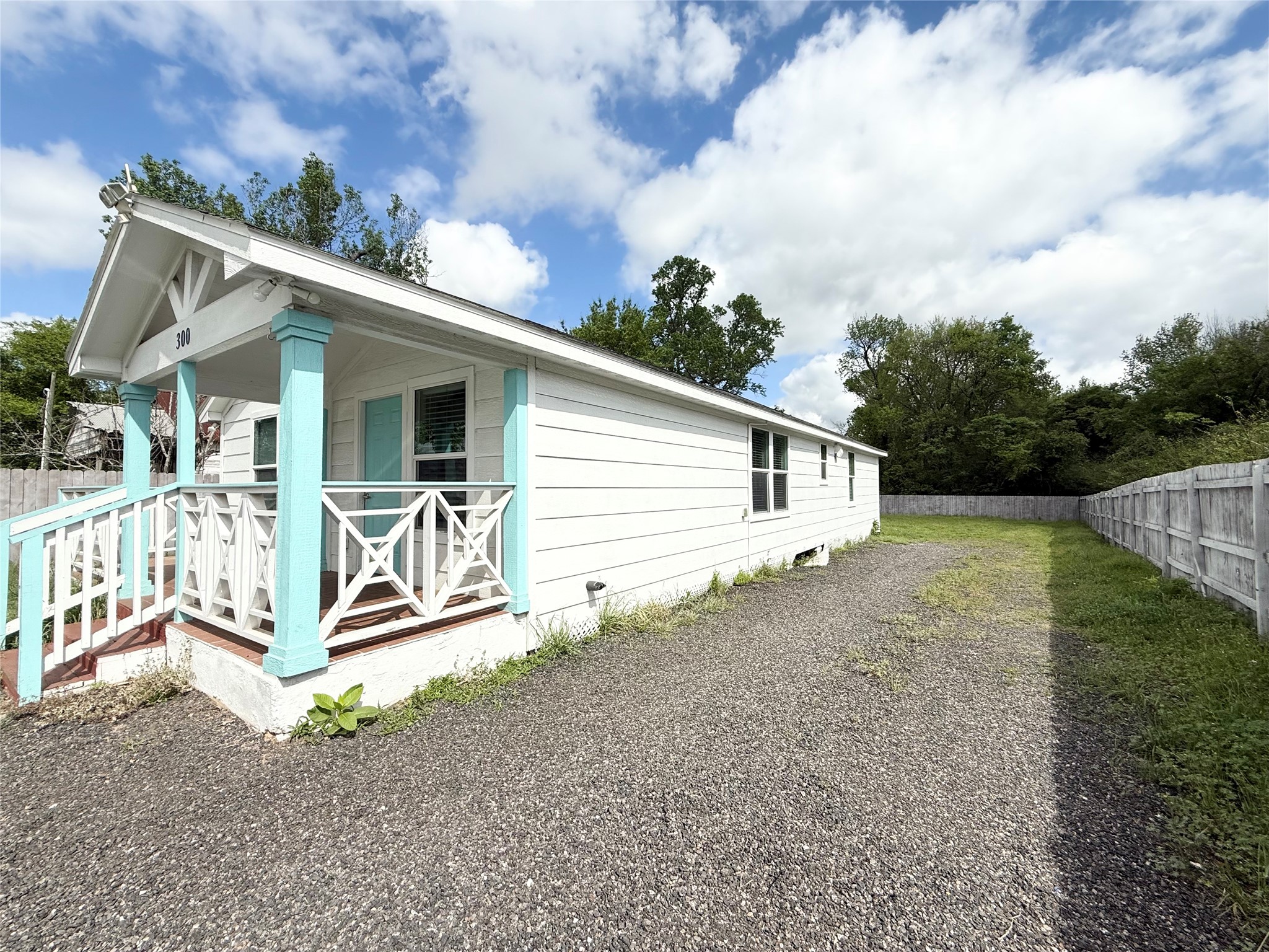 300 Longstreet Road Willis, TX 77378 - Photo 23 of 30 View of Side yard and driveway