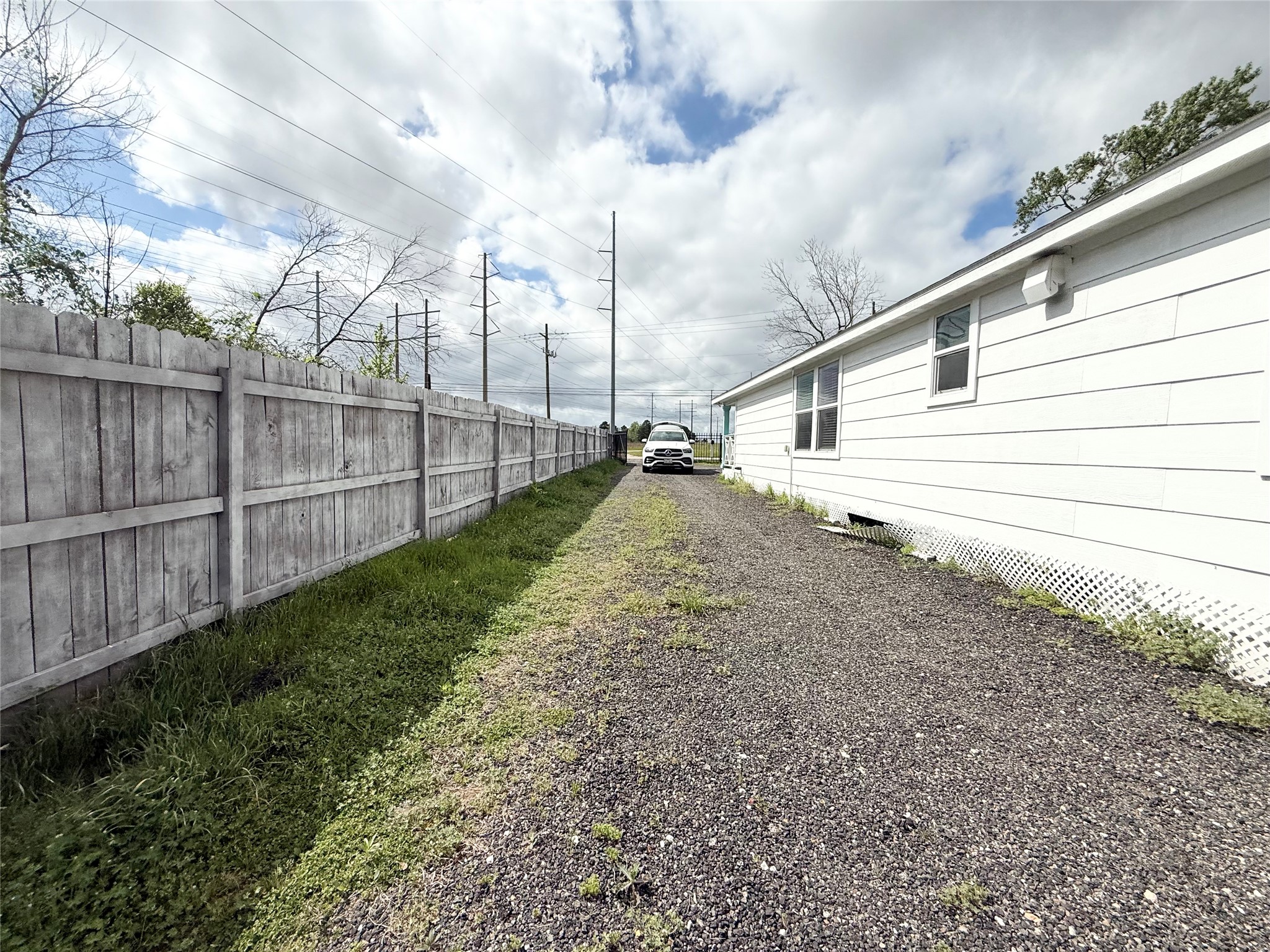 300 Longstreet Road Willis, TX 77378 - Photo 28 of 30 Side yard and driveway
