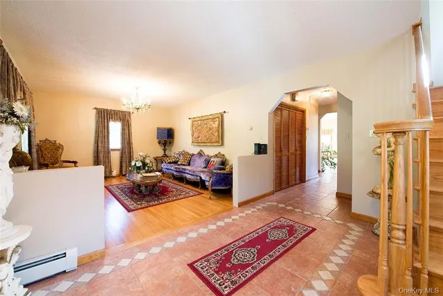 a living room with furniture rug and a table