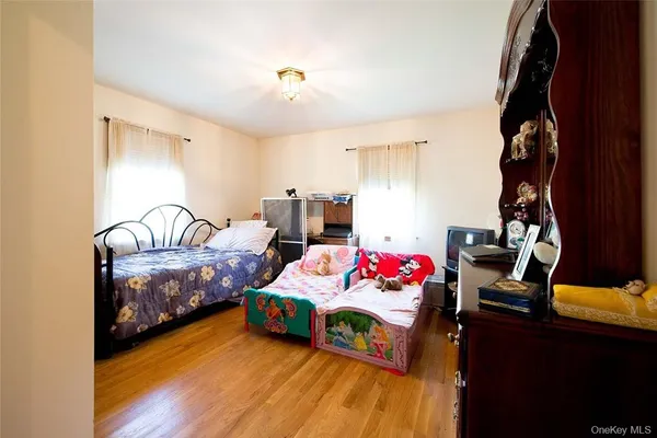 a bedroom with bed and a window