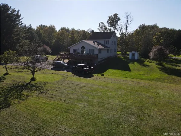a aerial view of a house with a yard
