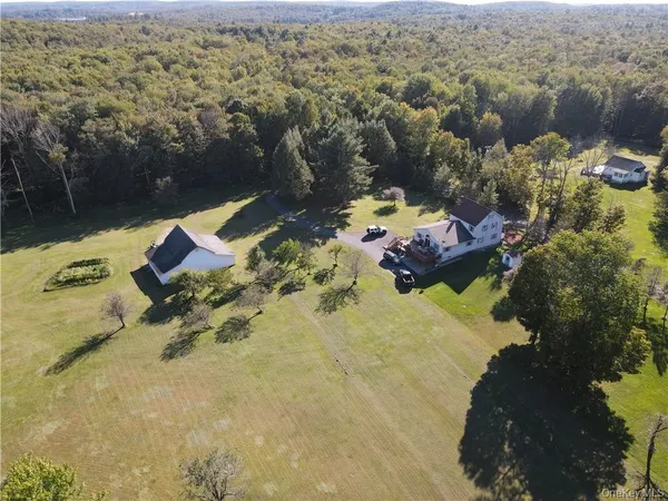 an aerial view of a house with a lake view
