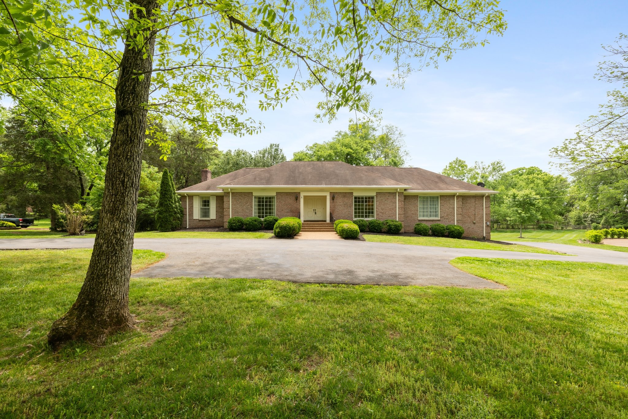 1409 Sneed Road West Franklin, TN 37069 - Photo 1 of 47 a front view of house with yard and green space