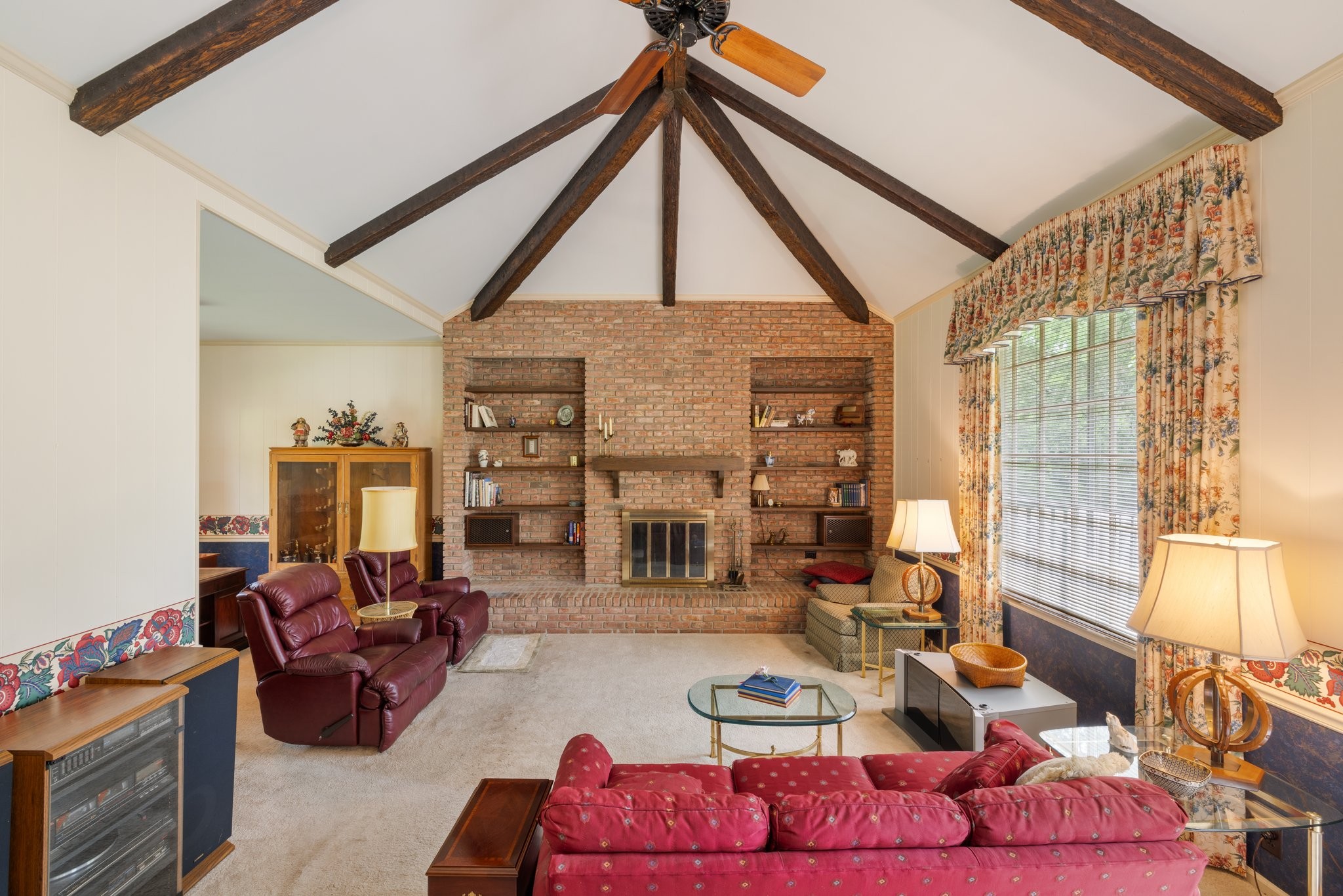 1409 Sneed Road West Franklin, TN 37069 - Photo 19 of 47 a living room with furniture a fireplace and large windows