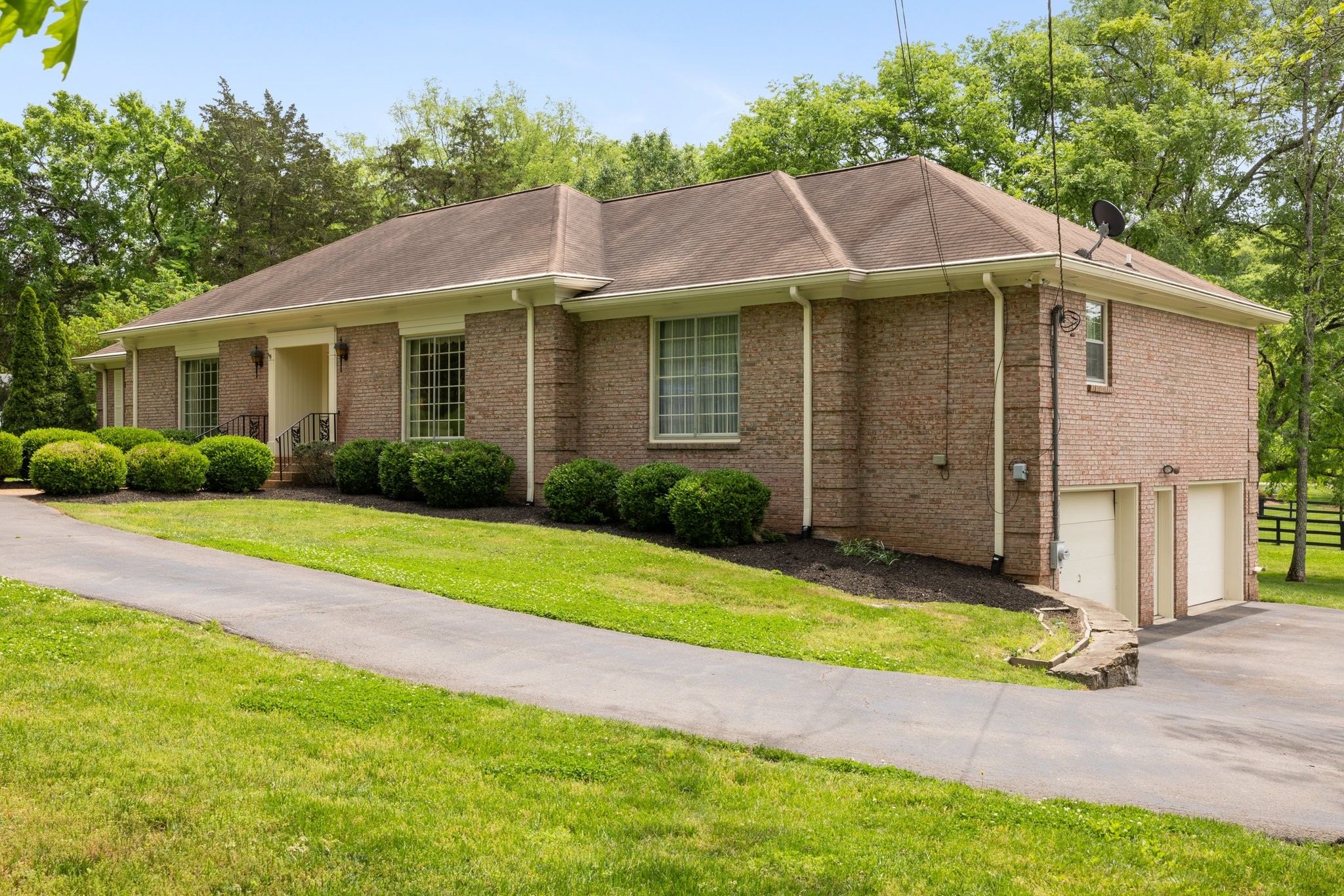 1409 Sneed Road West Franklin, TN 37069 - Photo 3 of 47 a view of a house with a yard and plants