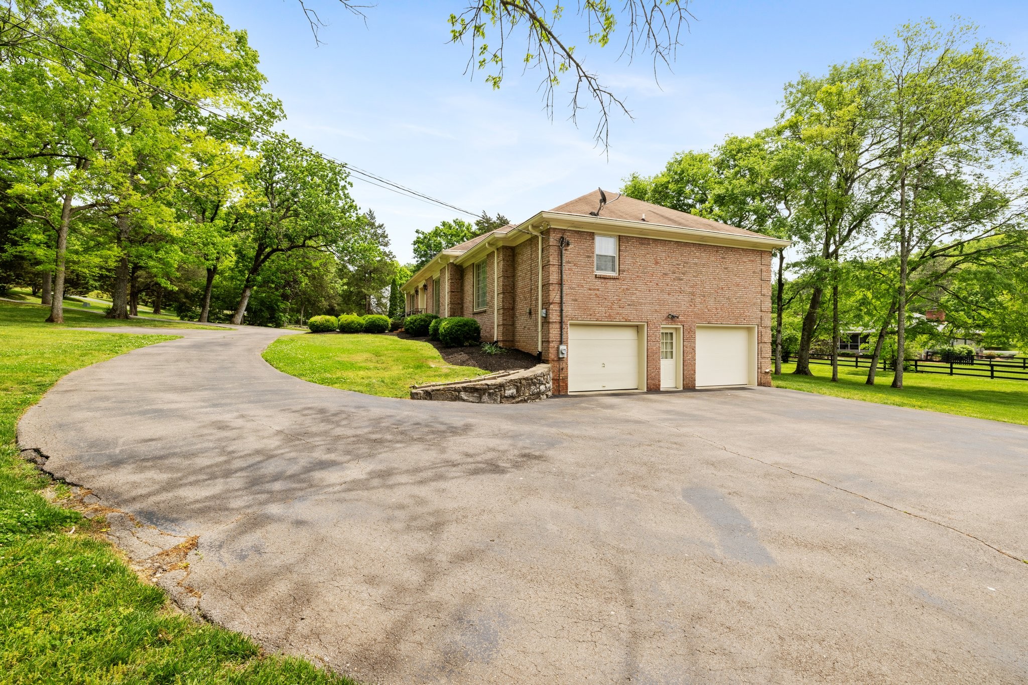 1409 Sneed Road West Franklin, TN 37069 - Photo 40 of 47 a big house with a big yard and large trees