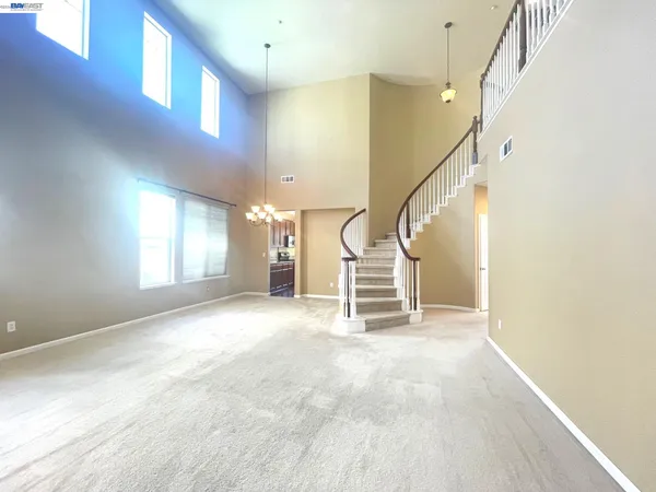 a kitchen with a refrigerator and a microwave