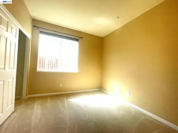 a view of a hallway with windows