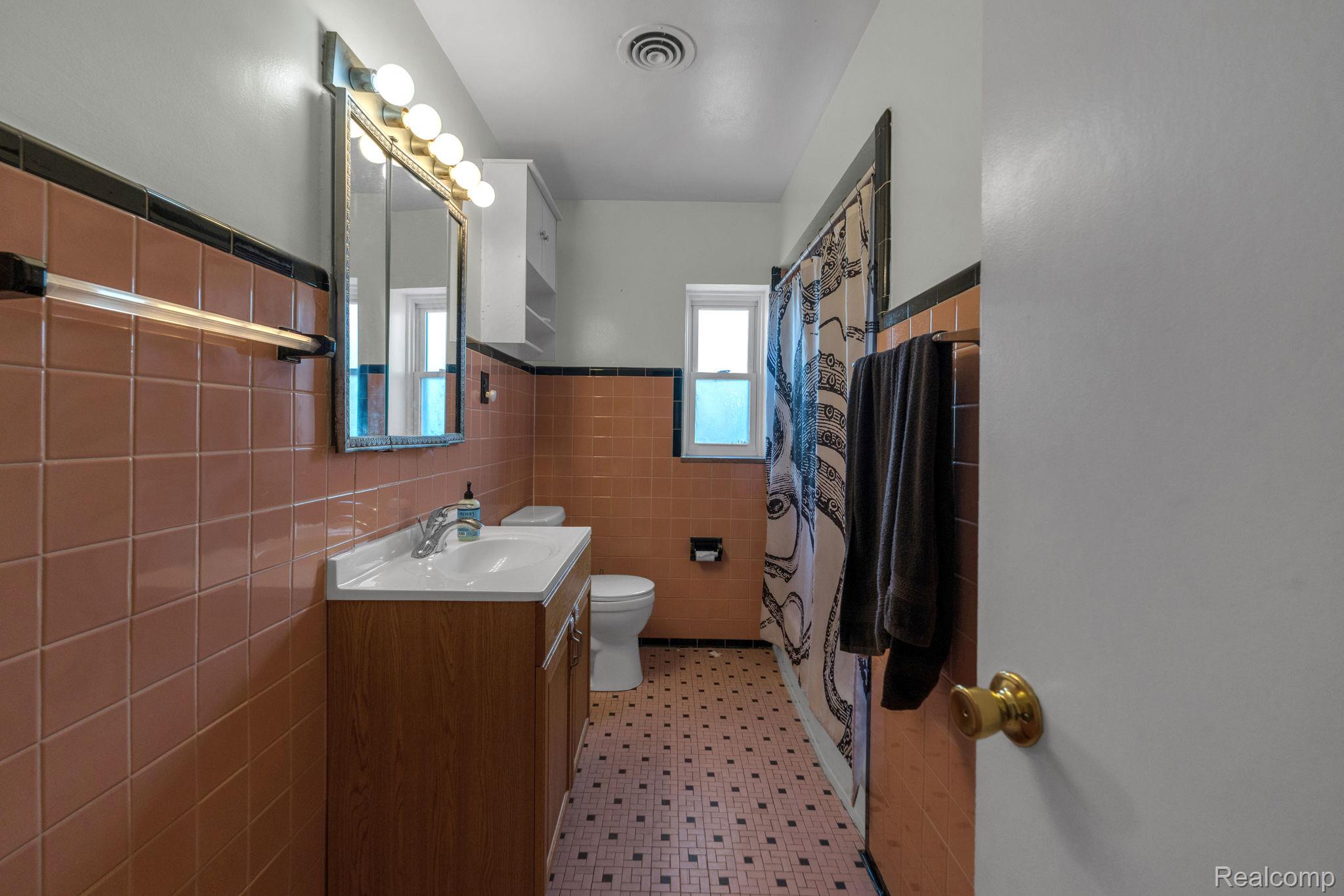 5223 Allen Road Allen Park, MI 48101 - Photo 11 of 12 Bathroom with a light wood-finish vanity and white countertop