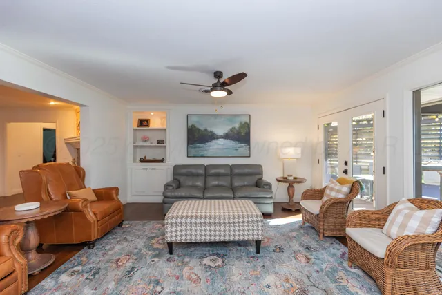 a bedroom with a large bed and a large window