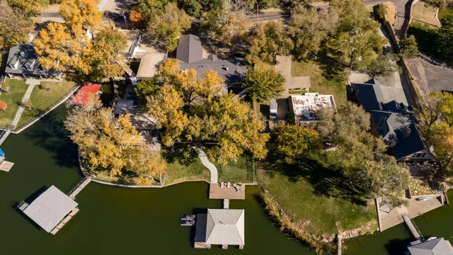 a view of a park with a large trees